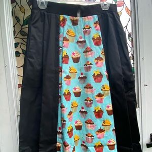 Below the knee black skirt with cupcake print